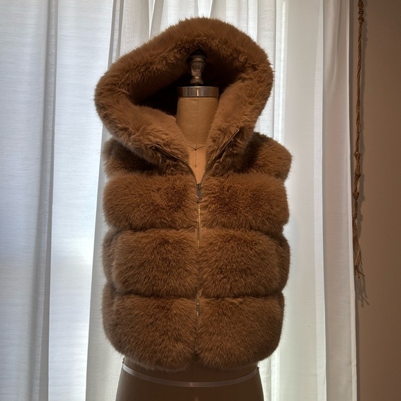 Super soft and plush faux fur hooded vest. Adrienne Landau fur vest